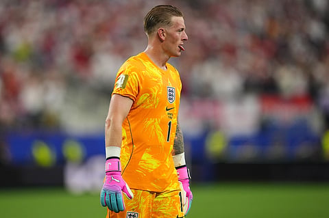 England goalkeeper Jordan Pickford reacts after his teammate Harry Kane scored during the World Cup Group L soccer match between England and Croatia in Arlington, Texas, near Dallas