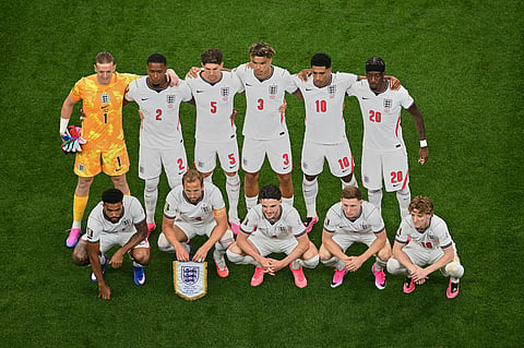 England's player pose for a team photo before the start of the World Cup Group L soccer match between England and Croatia in Arlington, Texas, near Dallas