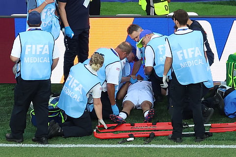 Iraq's Ali Jasim (17) is tended by medical staff during the World Cup Group I soccer match between Iraq and Norway in Foxborough, Mass., near Boston, Tuesday, June 16, 2026.