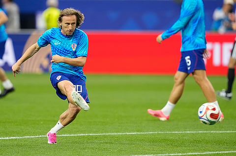Croatia's Luka Modric (10) warms up before the World Cup Group L soccer match between England and Croatia in Arlington, Texas, near Dallas