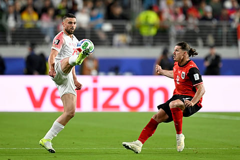 Jordan's Mohammad Aldaoud (25) controls the ball against Austria's Marcel Sabitzer (9) during the World Cup Group J soccer match between Austria and Jordan in Santa Clara, Calif., near San Francisco, Tuesday, June 16, 2026.