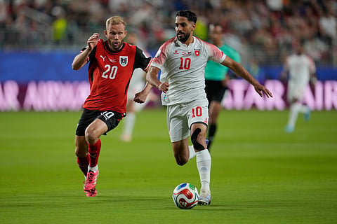 Jordan's Mousa Altamari (10) battles for the ball with Austria's Konrad Laimer (20) during the World Cup Group J soccer match between Austria and Jordan in Santa Clara, Calif., near San Francisco, Tuesday, June 16, 2026.