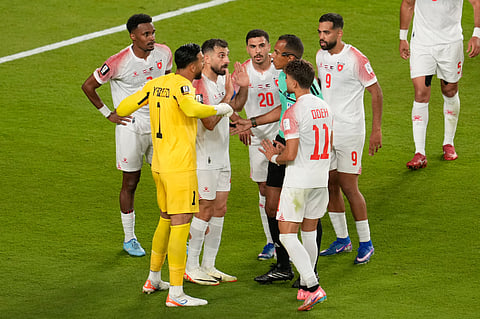 Jordan players argue with referee Dahane Beida of Mauritania, during the World Cup Group J soccer match against Austria in Santa Clara, Calif., near San Francisco, Tuesday, June 16, 2026.