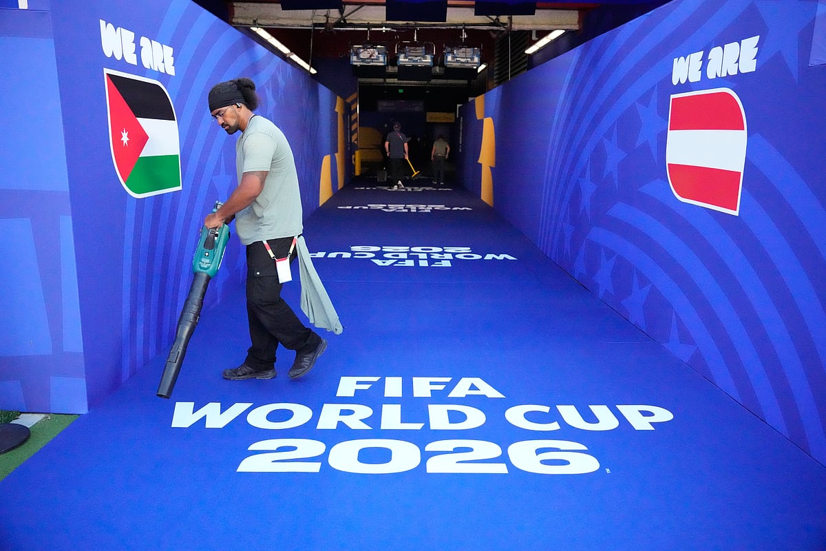 A man cleans ahead of the World Cup Group J soccer match between Austria and Jordan in Santa Clara, Calif., near San Francisco, Tuesday, June 16, 2026. - AP Photo/Eugene Hoshiko