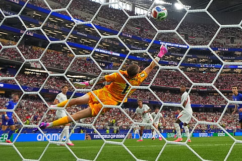 England goalkeeper Jordan Pickford (1) is beaten by a shot from Croatia's Martin Baturina (16) to score their first goal during the World Cup Group L soccer match between England and Croatia in Arlington, Texas, near Dallas