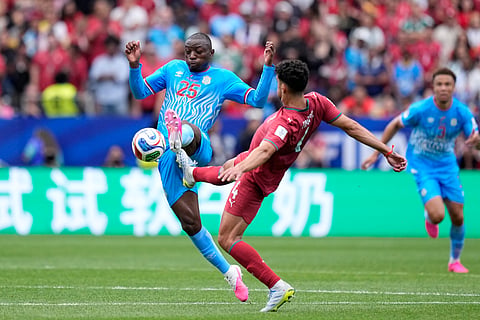 Portugal's Tomas Araujo vies for the ball with Congo's Edo Kayembe, left