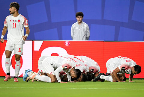 Jordan players celebrate after the opening goal by Ali Olwan during the World Cup Group J soccer match between Austria and Jordan in Santa Clara, Calif., near San Francisco.