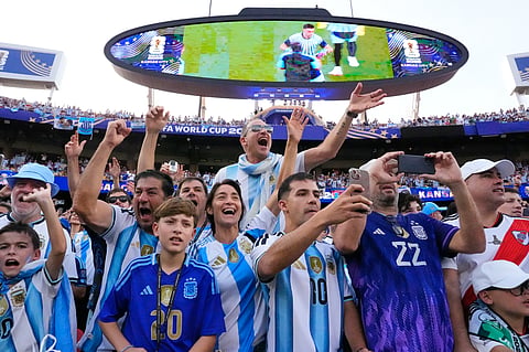 Argentinian fans react ahead of the World Cup Group J soccer match between Argentina and Algeria in Kansas City, Mo., Tuesday, June 16, 2026.