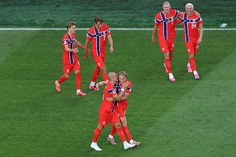 Norway's Leo Oestigard (4) celebrates with teammate Norway's Kristian Thorstvedt (18) after scoring his side's third goal during the World Cup Group I soccer match between Iraq and Norway in Foxborough, Mass., near Boston, Tuesday, June 16, 2026.