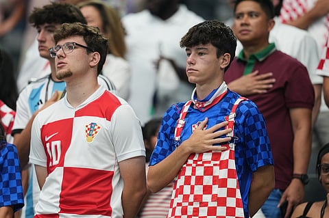 Fans listen the United States national anthem prior to the World Cup Group L soccer match between England and Croatia in Arlington, Texas, near Dallas.