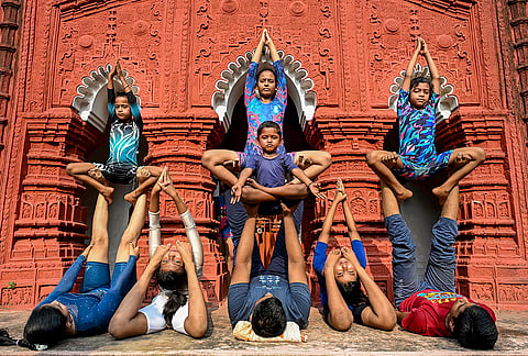 Participants perform yoga during a session ahead of the International Day of Yoga, in Nadia.
