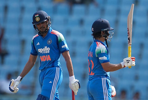 India's Ishan Kishan, right, celebrates his fifty runs as India's captain Shubman Gill looks on during the second ODI cricket match between India and Afghanistan in Lucknow.