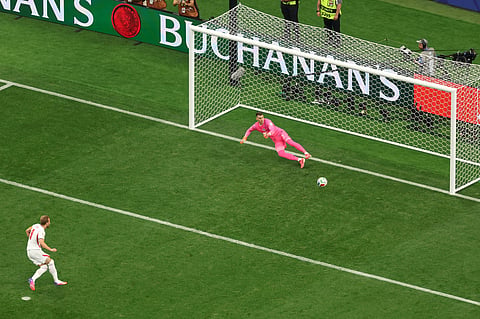 England's Harry Kane (9) scores from a penalty kick during the World Cup Group L soccer match between England and Croatia in Arlington, Texas, near Dallas,