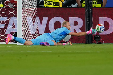 Austria goalkeeper Alexander Schlager (1) makes a save during the World Cup Group J soccer match between Austria and Jordan in Santa Clara, Calif., near San Francisco, Tuesday, June 16, 2026.