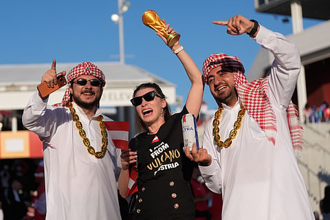 An Austria fan, center, and Jordan fans cheer for their teams before the World Cup Group J soccer match in Santa Clara, Calif., near San Francisco, Tuesday, June 16, 2026.