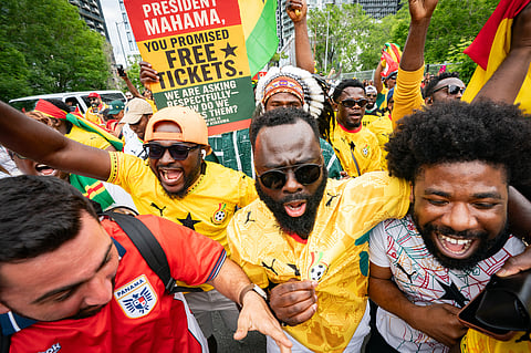 Ghana fans participate in a fan march toward Toronto Stadium before the World Cup Group L soccer match between Ghana and Panama in Toronto