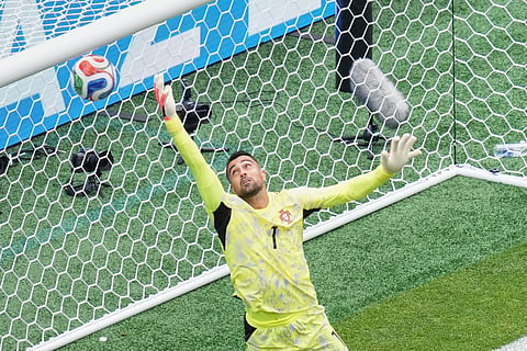 Portugal goalkeeper Diogo Costa (1) fails to save first goal during the World Cup Group K soccer match 