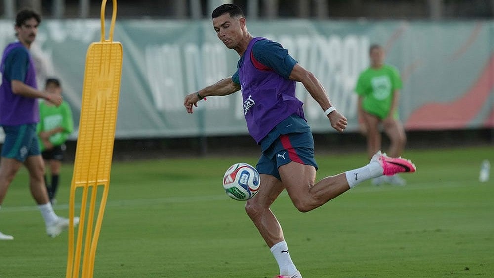 Portugal's Cristiano Ronaldo runs drills during the men's national soccer team training session ahead of their FIFA World Cup soccer tournament in Palm Beach Gardens, Fla. - | Photo: AP/Marta Lavandier