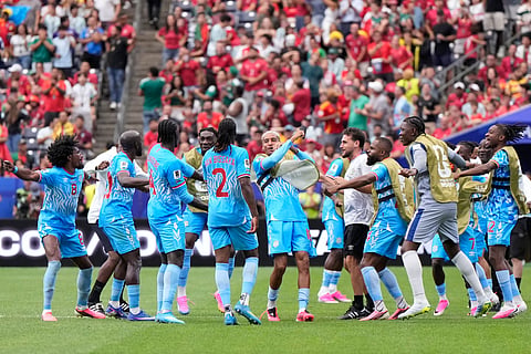 Congo's Yoane Wissa (20) celebrates after scoring during the World Cup Group K soccer match between Portugal and Congo