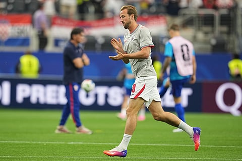 England's Harry Kane warms up prior to the World Cup Group L soccer match between England and Croatia in Arlington, Texas, near Dallas