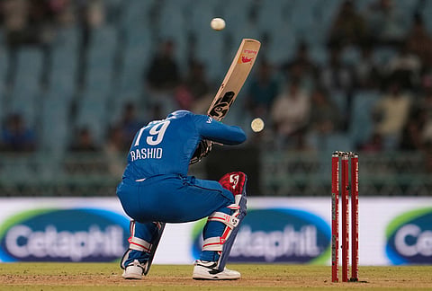 Afghanistan's Rashid Khan ducks a bouncer during the second ODI cricket match between India and Afghanistan in Lucknow.