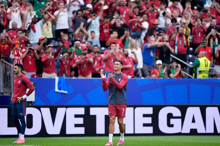 Portugal's Cristiano Ronaldo applauds the fans during warmup - APAshley Landis