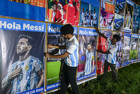 People put up banners of Argentina National team footballer Lionel Messi amid the ongoing FIFA World Cup 2026, in Kolkata, West Bengal.