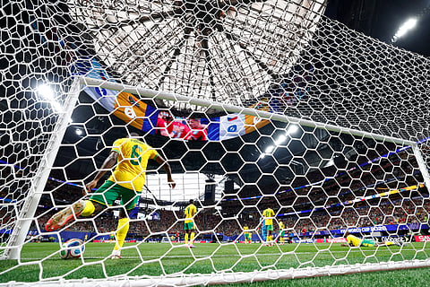 South Africa's Aubrey Modiba retrieves the ball from the net after Czechia's Michal Sadilek scored during the World Cup Group A soccer match between Czechia and South Africa in Atlanta, Thursday, June 18, 2026.