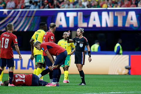 Referee Tori Penso, speaks to South Africa's Teboho Mokoena (4) during the World Cup Group A soccer match between Czechia and South Africa in Atlanta, Thursday, June 18, 2026.