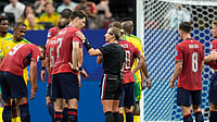 (AP Photo/Mike Stewart) : Referee Tori Penso, of the United States, speaks to Czechia's team captain Ladislav Krejci during the World Cup Group A soccer match between Czechia and South Africa in Atlanta, Thursday, June 18, 2026. 