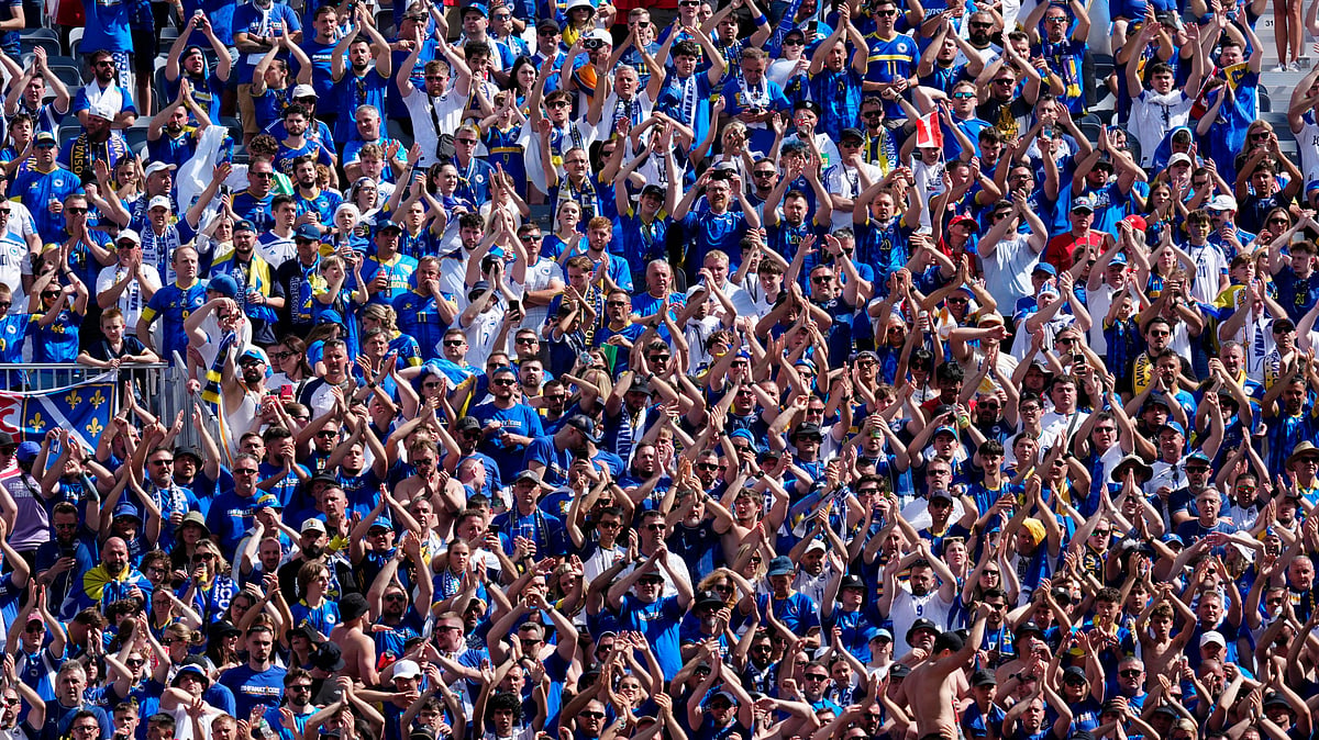 Bosnian fans cheer on their team during the second half of the FIFA World Cup 2026, Group B match between Canada and Bosnia in Toronto on Friday, June 12, 2026 - Frank Gunn/The Canadian Press via AP