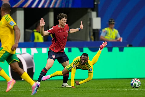 South Africa's Thapelo Maseko falls to the ground in front of Czechia's Ladislav Krejci during the World Cup Group A soccer match between Czechia and South Africa in Atlanta, Thursday, June 18, 2026.