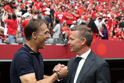 Qatar head coach Julen Lopetegui, left, and Canada head coach Jesse Marsch shake hands before the World Cup Group B soccer match between Canada and Qatar in Vancouver, British Columbia, Thursday, June 18, 2026.