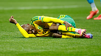 (AP Photo/Erik S. Lesser) : South Africa's Khuliso Mudau lies on the ground during the World Cup Group A soccer match between Czechia and South Africa in Atlanta, Thursday, June 18, 2026.
