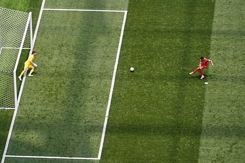 Switzerland's Granit Xhaka (10) beats Bosnia goalkeeper Nikola Vasilj (1) from the penalty spot to score his side's fourth goal during the World Cup Group B soccer match between Switzerland and Bosnia in Inglewood, Calif., near Los Angeles, Thursday, June 18, 2026.
