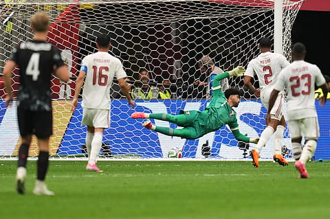 Qatar goalkeeper Mahmoud Abunada fails to save the goal from Canada's Jonathan David during the World Cup Group B soccer match in Vancouver, British Columbia, Thursday, June 18, 2026.