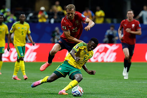 Czechia's Tomas Soucek, background, stops South Africa's Teboho Mokoena during the World Cup Group A soccer match between Czechia and South Africa in Atlanta, Thursday, June 18, 2026.