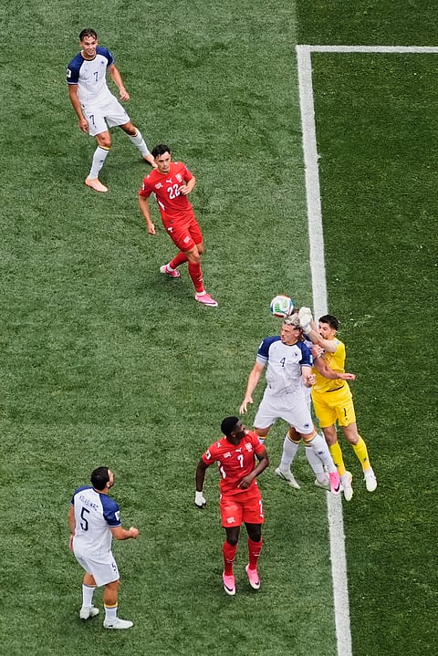 Bosnia goalkeeper Nikola Vasilj (1) punches the ball away during the World Cup Group B soccer match between Switzerland and Bosnia in Inglewood, Calif., near Los Angeles, Thursday, June 18, 2026.