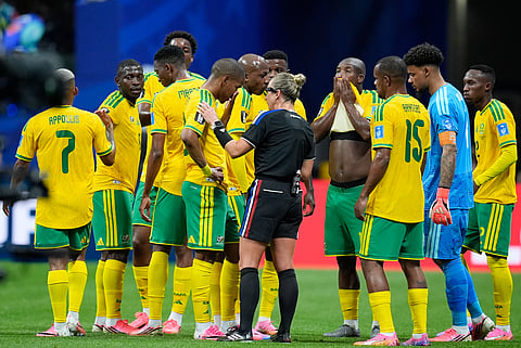 Referee Tori Penso, of the United States, speaks to South Africa's Iqraam Rayners during the World Cup Group A soccer match between Czechia and South Africa in Atlanta, Thursday, June 18, 2026.