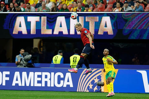 Czechia's Tomas Holes, top, heads the ball as South Africa's Oswin Appollis looks on during the World Cup Group A soccer match between Czechia and South Africa in Atlanta, Thursday, June 18, 2026.