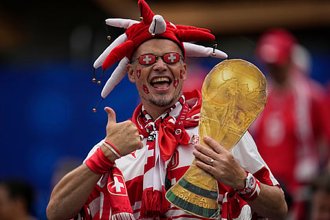 Bosnia's fans wave their team flags outside the stadium ahead the World Cup Group B soccer match between Switzerland and Bosnia in Inglewood, Calif, near Los Angeles, Thursday, June 18, 2026.