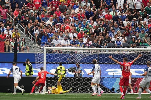 Bosnia goalkeeper Nikola Vasilj, bottom, catches the ball during the World Cup Group B soccer match between Switzerland and Bosnia in Inglewood, Calif., near Los Angeles, Thursday, June 18, 2026.