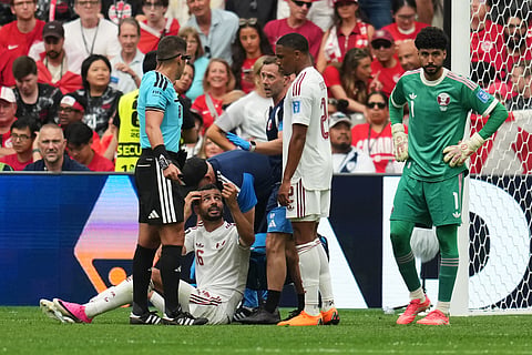 Qatar's Boualem Khoukhi, below, receives medical attention during the World Cup Group B soccer match against Canada in Vancouver, British Columbia, Thursday, June 18, 2026.