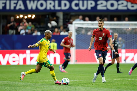 South Africa's Oswin Appollis, left, passes the ball as Czechia's Patrik Schick looks on during the World Cup Group A soccer match between Czechia and South Africa in Atlanta, Thursday, June 18, 2026.