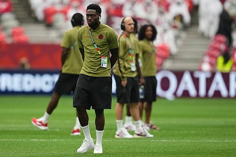Canada's Alphonso Davies walks on the pitch as his team arrives prior to the World Cup Group B soccer match against Qatar in Vancouver, British Columbia, Thursday, June 18, 2026.