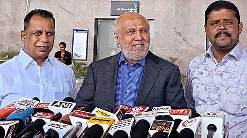 Sri Lankan MP Rauff Hakeem, centre, addresses a press conference after his arrival at the Tiruchirappalli International Airport, in Tiruchirappalli district, Tamil Nadu.