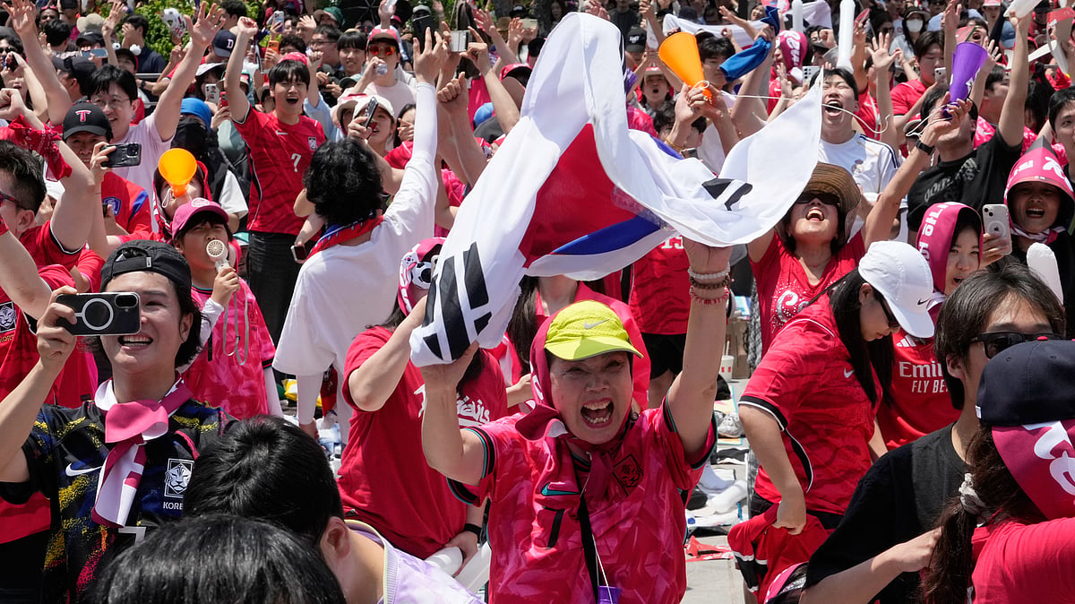 South Korean soccer fans celebrate after South Korea defeated Czechia during the Group A World Cup soccer match in Mexico, at a public viewing venue in Seoul, South Korea, Friday, June 12, 2026. - (AP Photo/Ahn Young-joon)