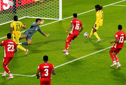 Ghana's Caleb Yirenkyi (3) scores the opening goal on Panama goalkeeper Orlando Mosquera (22) during the World Cup Group L soccer match between Ghana and Panama in Toronto.