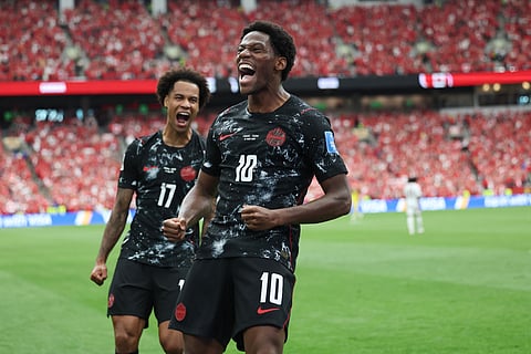 Canada's Jonathan David (10) celebrates after scoring their second goal during the World Cup Group B soccer match between Canada and Qatar in Vancouver, British Columbia, Thursday, June 18, 2026.