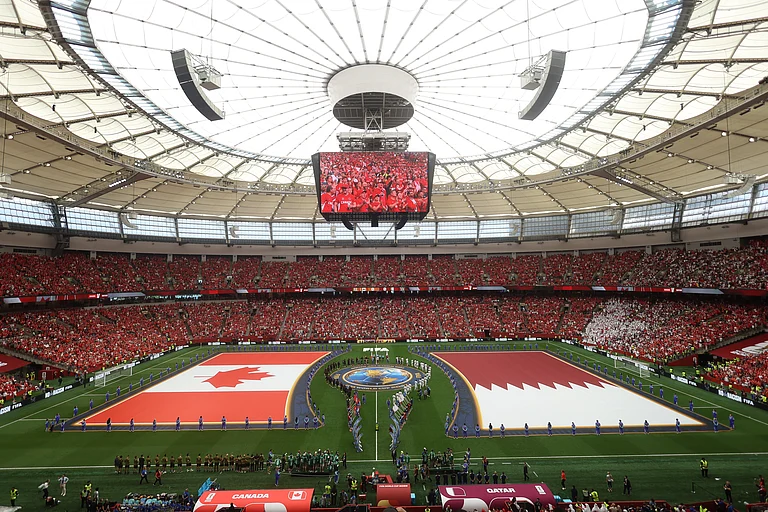 The national flags of Canada and Qatar are displayed during opening ceremonies for the World Cup Group B soccer match between Canada and Qatar in Vancouver, British Columbia, Thursday, June 18, 2026. - AP Photo/Kaleb Tatum